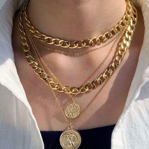 4 layered gold necklace.